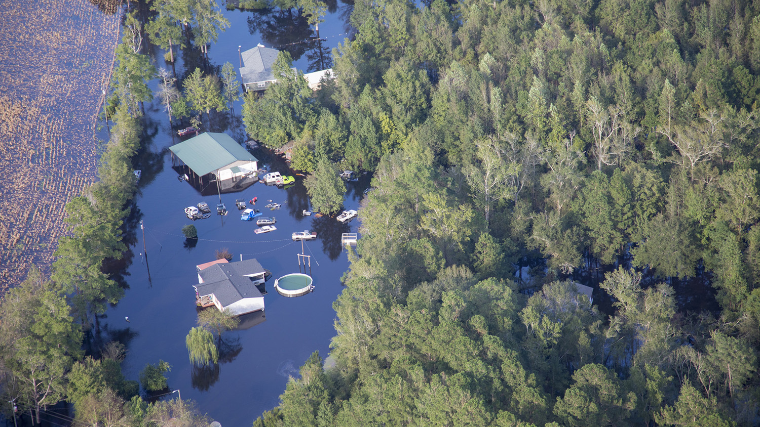 Hurricane Florence causes the Cape Fear River to flood, nearly submerging homes, above ground swimming pools, and vehicles.