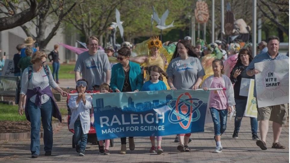 Children and adults join together for the Raleigh March for Science.