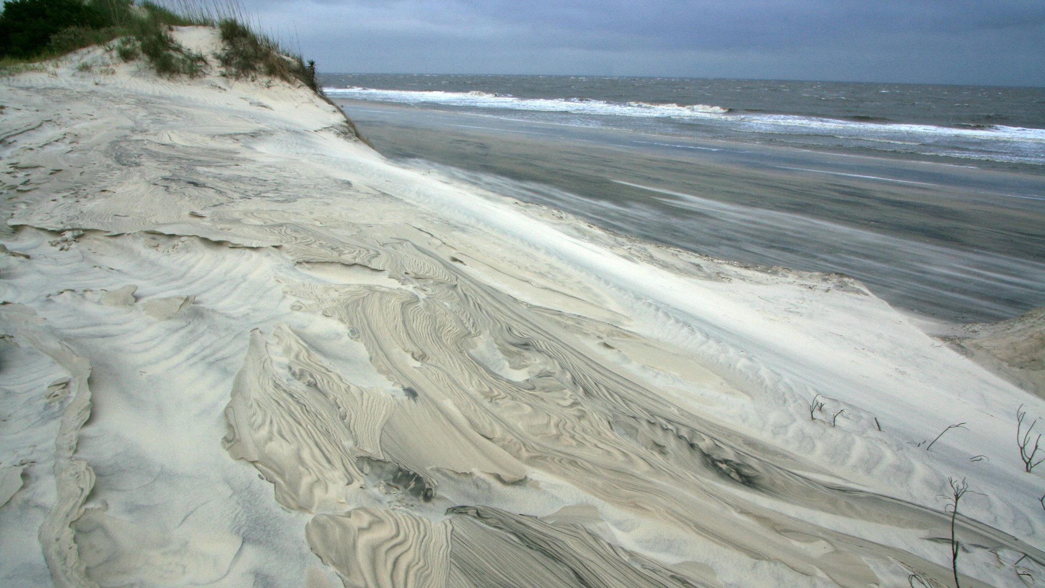 Beach scene with white swirled sand